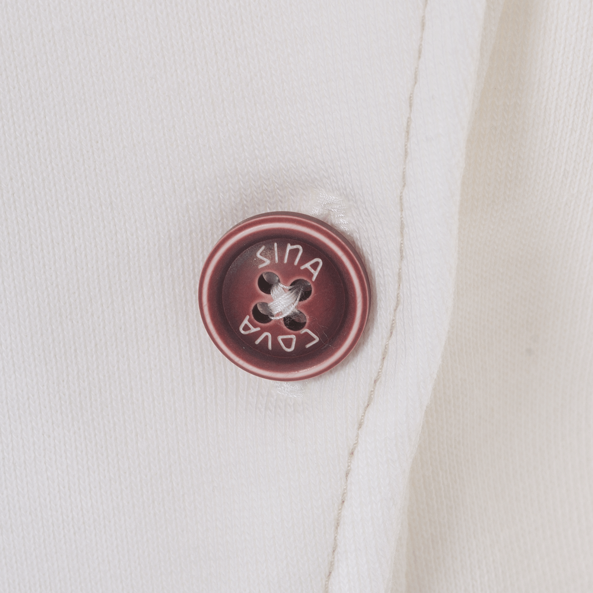 【公式】シナコバ (SINA COVA) トラックジャケット 23113020 オフホワイトの左ポケットボタン部分