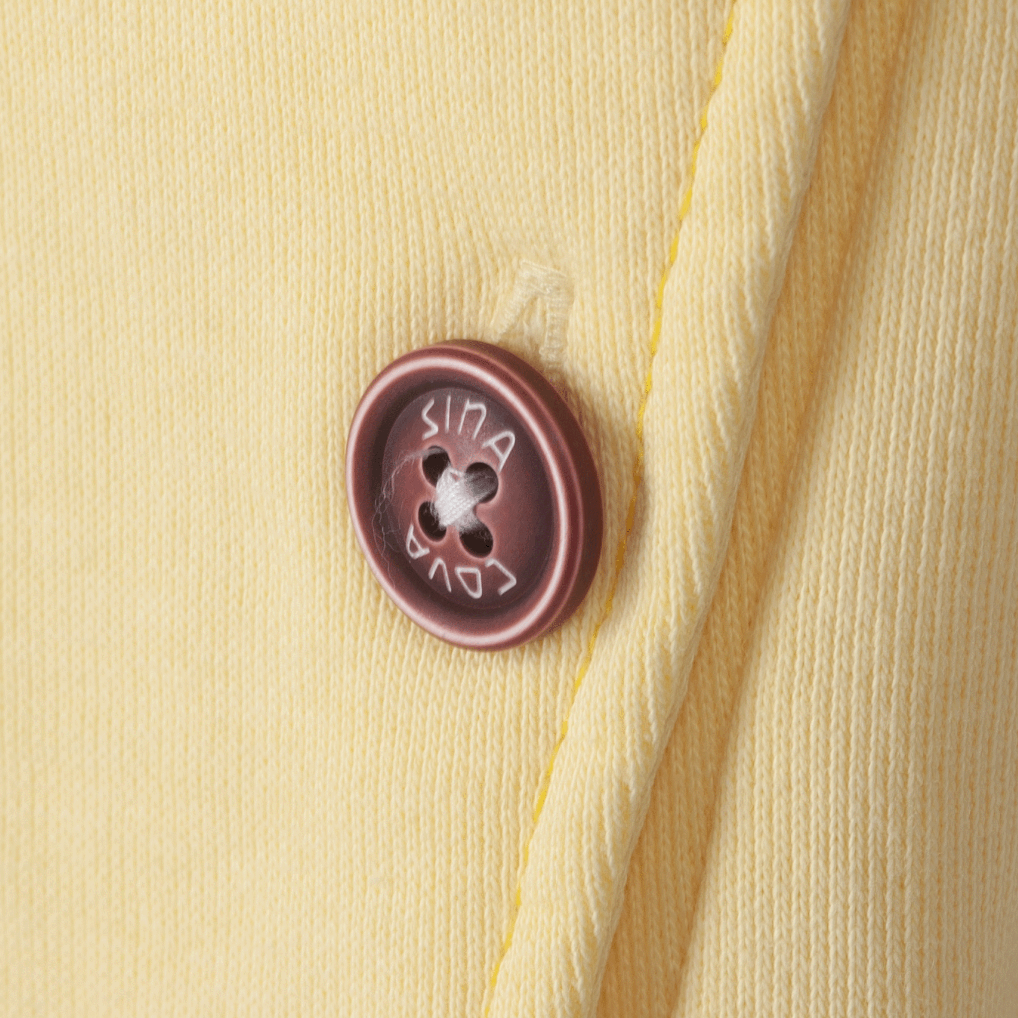 【公式】シナコバ (SINA COVA) トラックジャケット 23113020 イエローの左ポケットボタン部分